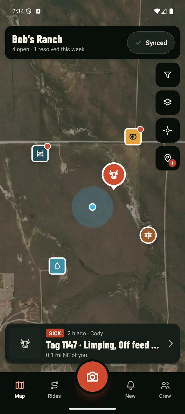 The Ranch Hand app's map at night: an aerial photo of Bob's Ranch with pins for a gate, a feed station, a water tank, a fence and a sick heifer, and a card for Tag 1147, limping and off feed, found by Cody 2 hours ago.